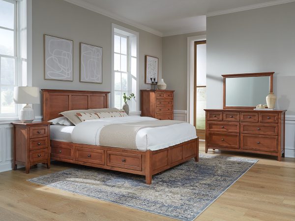 McKenzie Small 3-Drawer Nightstand in glazed antique cherry finish shown in bedroom set