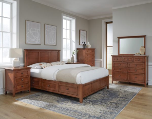 McKenzie 3-Drawer Nightstand in glazed antique cherry finish shown in bedroom set