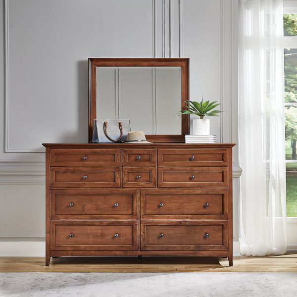 McKenzie Retangular Mirror in glazed antique cherry finish shown in bedroom set